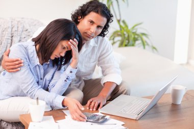 Couple worried about their finances clipart