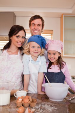 Portrait of a family baking together clipart