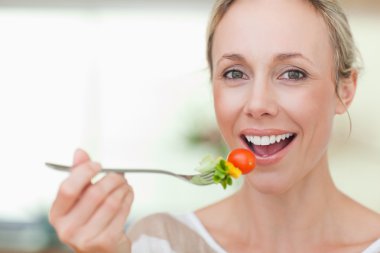 Woman having some salad clipart