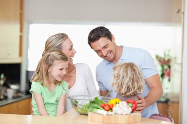 Happy family in the kitchen clipart