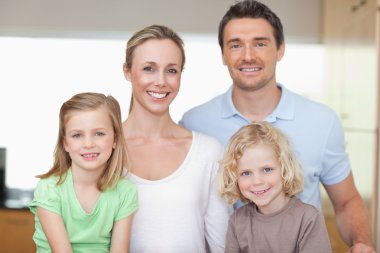 Cheerful family in the kitchen clipart