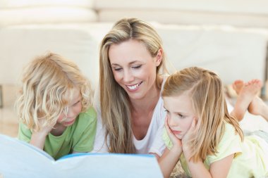 Mother reading story for children clipart