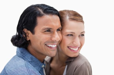 Close together standing couple looking to the right clipart