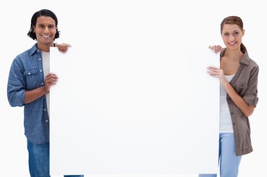 Couple holding a blank sign clipart