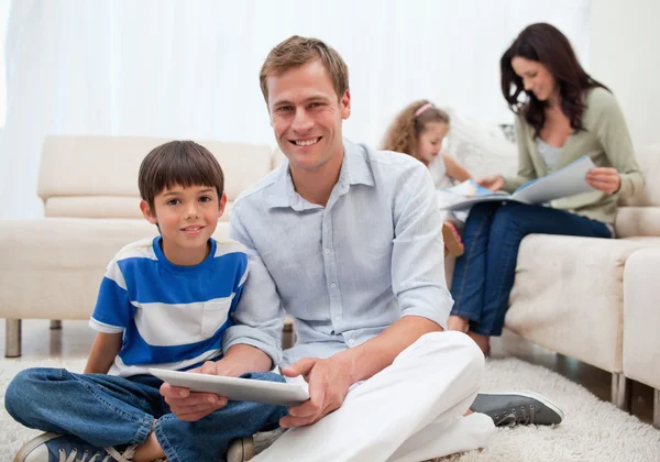 Family spending free time in the living room — Stock Photo, Image