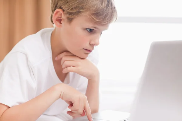 Young boy using a notebook — Stock Photo, Image