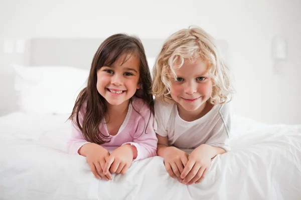 Children lying on their bellies — Stock Photo, Image