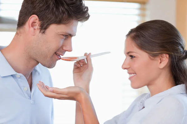 Stock image Close up of a man tasting his wife's sauce