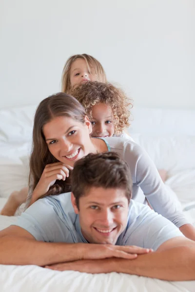Portrait of a family lying on each other — Stock Photo, Image