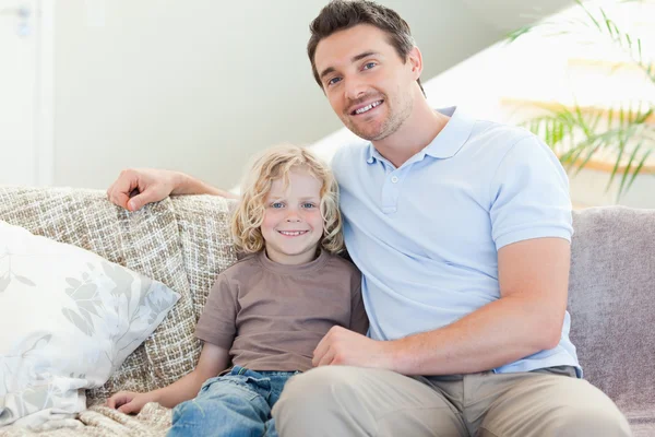 Father and son on sofa — Stock Photo, Image