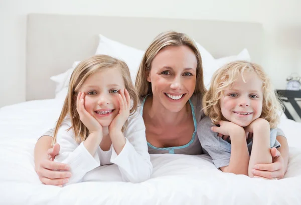 Mother embracing her children — Stock Photo, Image