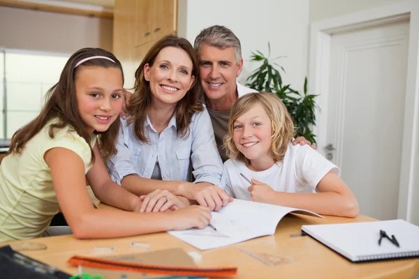 Family doing homework — Stock Photo, Image