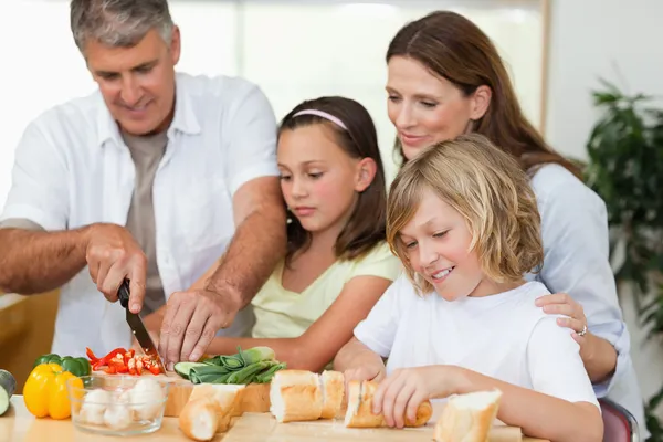 Family making sandwiches — Stock Photo, Image