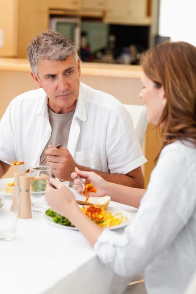 Man talking to wife during dinner — Stock Photo, Image