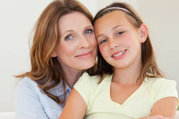 Mother hugging her daughter — Stock Photo, Image