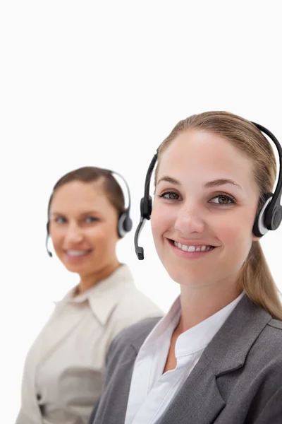 Portrait of young operators using headsets — Stock Photo, Image