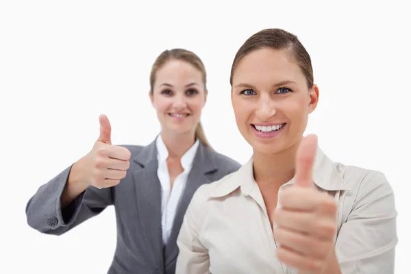 Sales persons posing with the thumb up — Stock Photo, Image