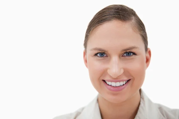Close up of a young businesswoman smiling at the camera — Stock Photo, Image