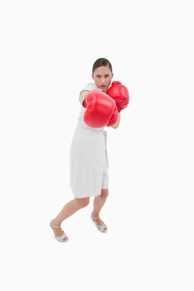 Portrait of a businesswoman punching someone — Stock Photo, Image