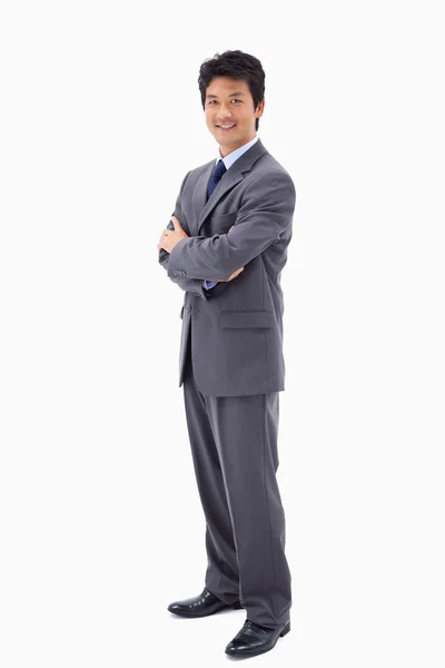 Portrait of a smiling businessman with the arms crossed — Stock Photo, Image
