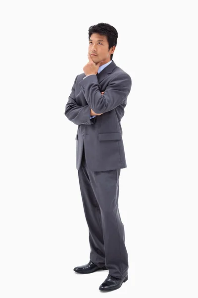 Portrait of a thoughtful businessman with the arms crossed — Stock Photo, Image