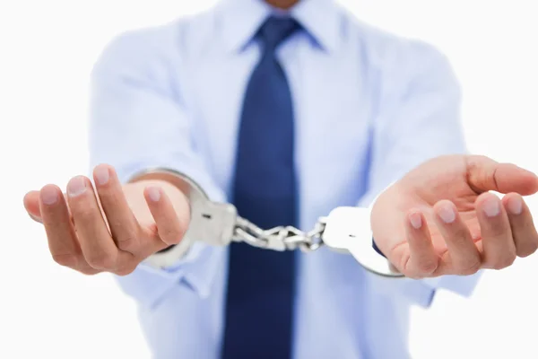 Close up of a professional's hands with handcuffs — Stock Photo, Image