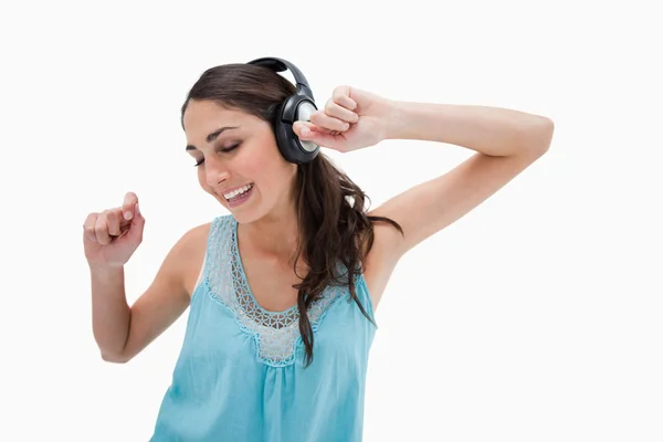 Woman dancing while listening to music — Stock Photo, Image