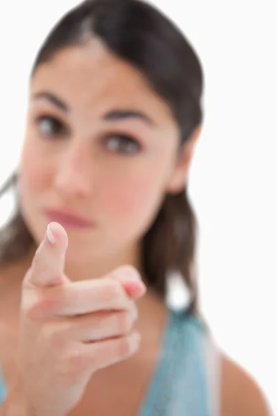Portrait of a woman pointing at the viewer — Stock Photo, Image