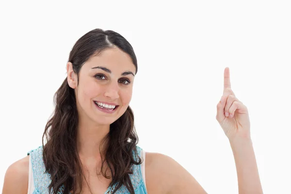 Woman pointing at a copy space — Stock Photo, Image