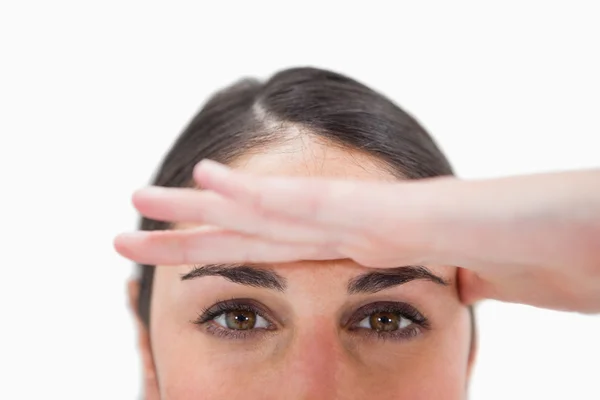 Close up of a woman with her hand on her forehead — Stock Photo, Image