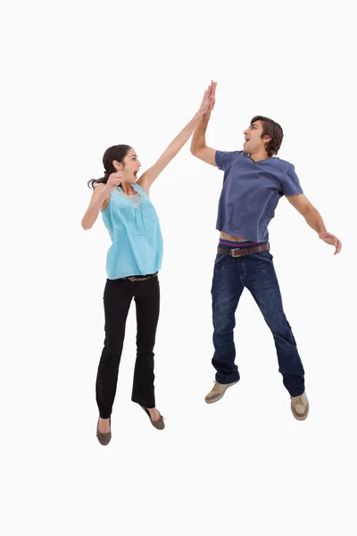 Portrait of a couple jumping together — Stock Photo, Image