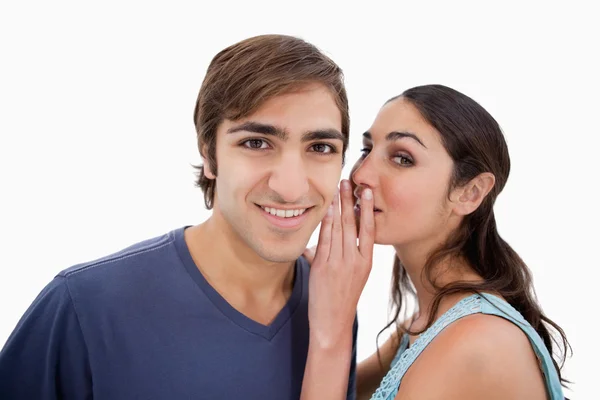 Young woman whispering something to her fiance — Stock Photo, Image
