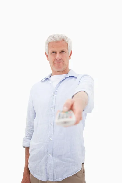 Portrait of a mature man switching of channel — Stock Photo, Image