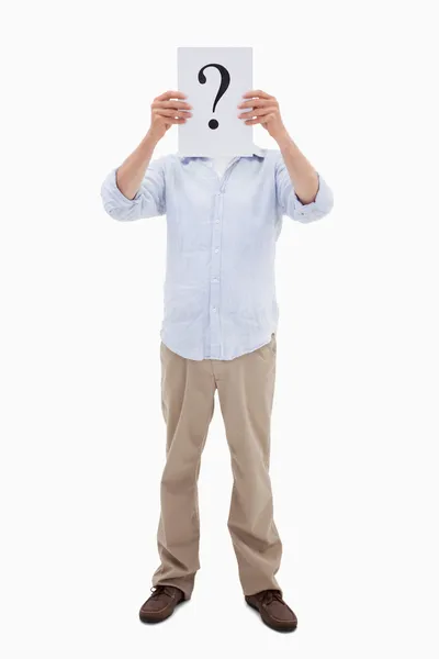 Portrait of a man holding a question mark on a paper — Stock Photo, Image