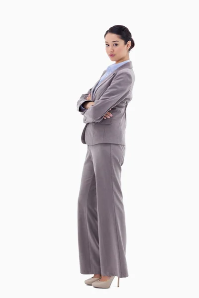 Portrait of a brunette businesswoman posing with the arms crosse — Stock Photo, Image