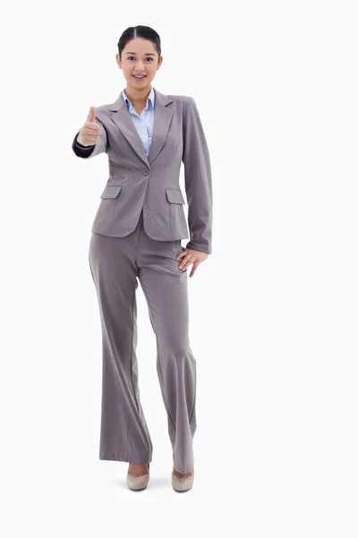 Portrait of a happy businesswoman posing with the thumb up — Stock Photo, Image