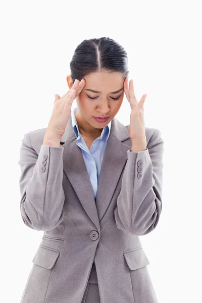 Portrait of a beautiful businesswoman having a headache — Stock Photo, Image
