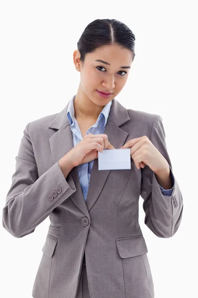 Portrait of a young businesswoman clipping her badge — Stock Photo, Image