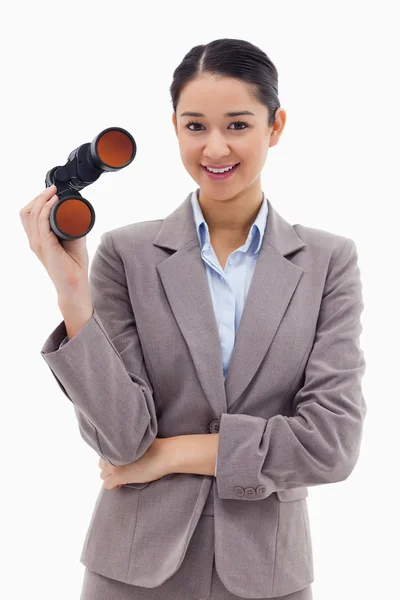 Portrait of a businesswoman holding binoculars — Stock Photo, Image