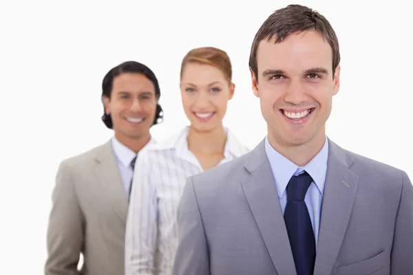 Smiling businessteam lined up — Stock Photo, Image