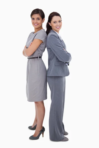Businesswomen standing back on back — Stock Photo, Image