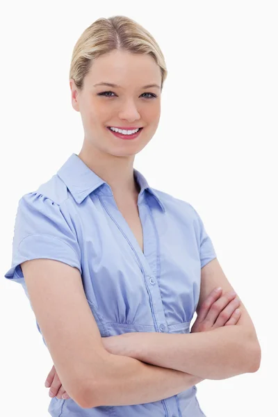 Smiling woman standing with arms folded — Stock Photo, Image
