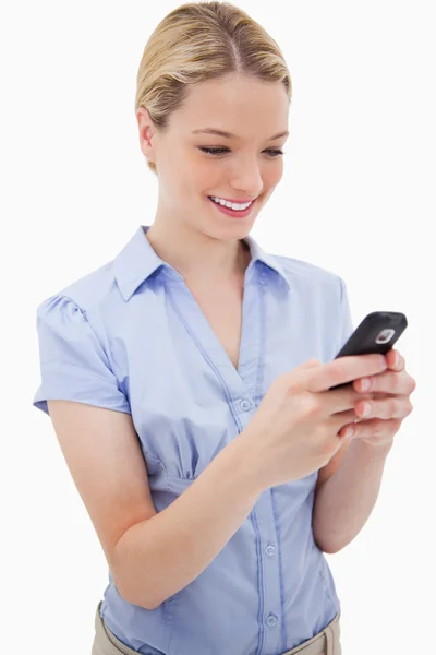 Smiling woman writing text message — Stock Photo, Image