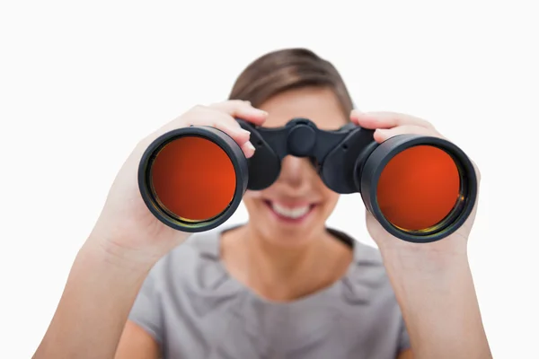 stock image Woman looking through spyglasses