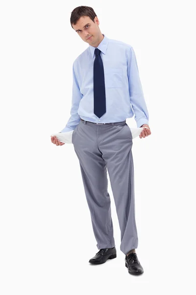 Businessman showing his empty pockets — Stock Photo, Image