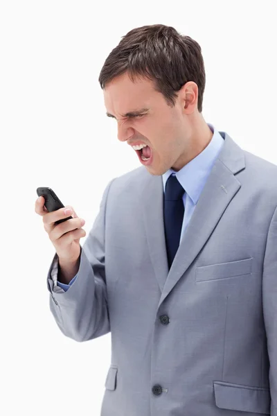 Empresário gritando com seu celular — Fotografia de Stock