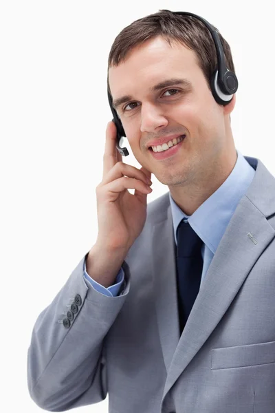 Homem de negócios usando fone de ouvido — Fotografia de Stock