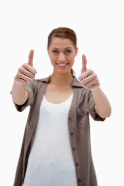 Thumbs up given by smiling woman — Stock Photo, Image
