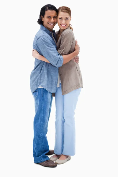 Side view of embracing happy couple — Stock Photo, Image