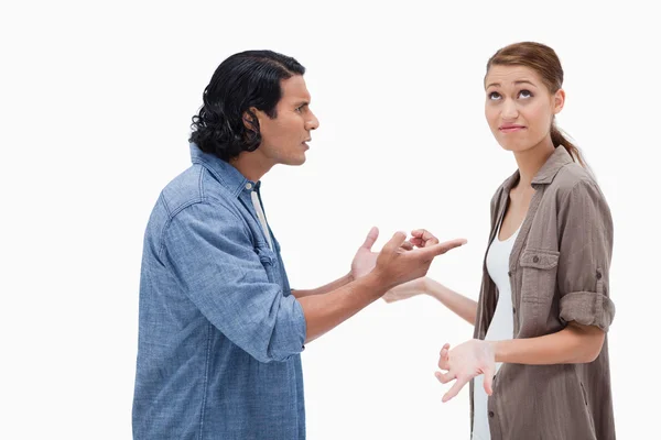 Side view of tensed talking couple — Stock Photo, Image